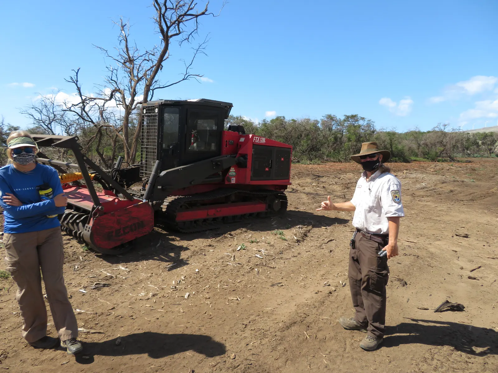 Skid steer mulching unit on freshly cleared ground